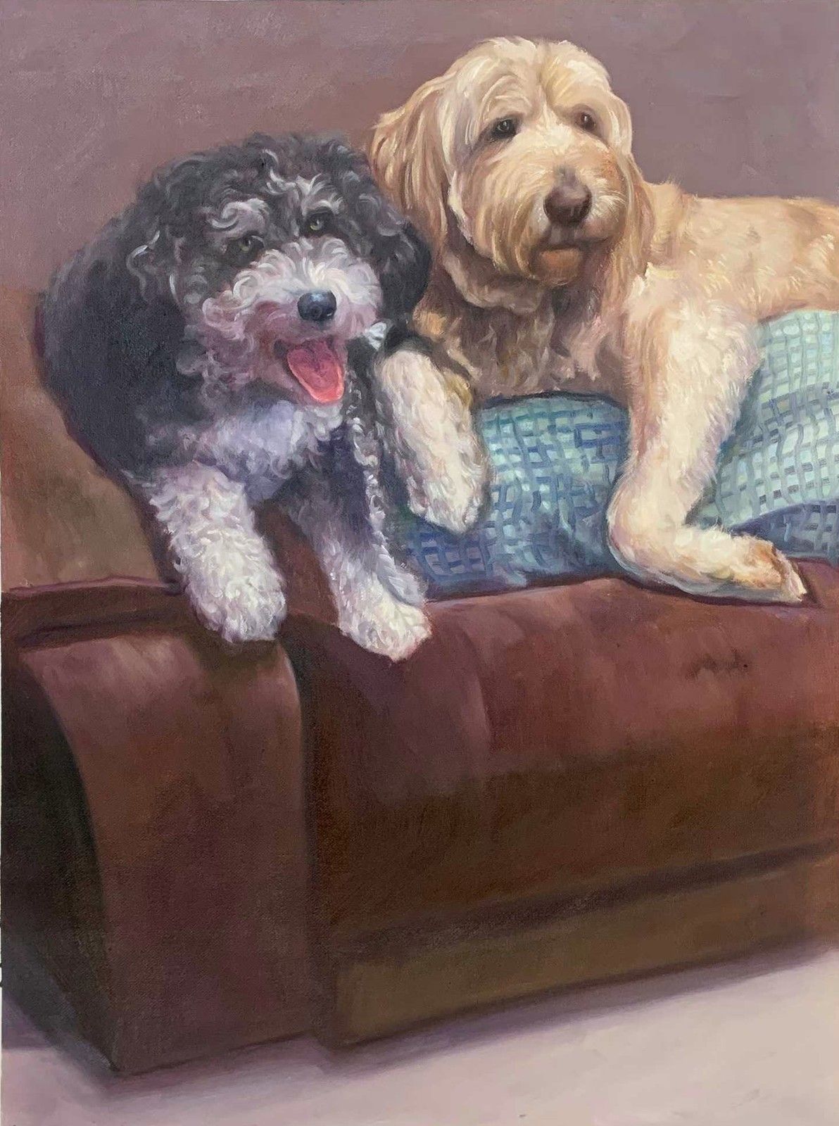 Two dogs resting together on a brown leather chair.