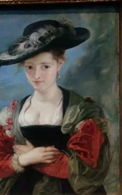 A copy after Rubens showing a woman in a broad hat, displayed in an ornate frame.