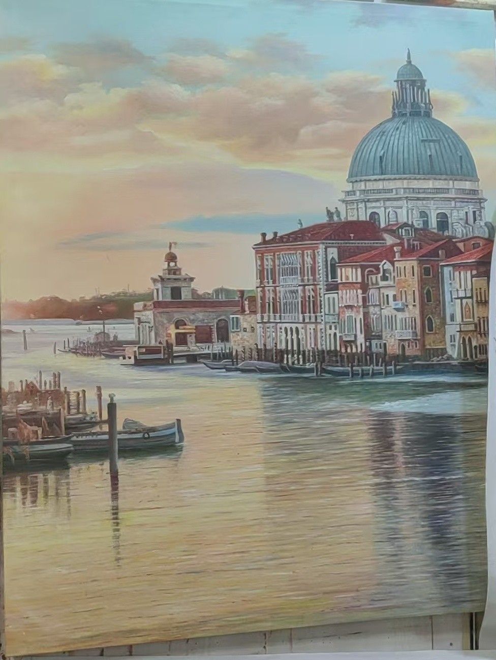 Venice palaces and a domed church line the Grand Canal beneath a softly colored evening sky.