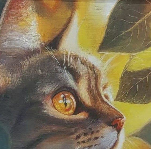 A tabby cat portrait in warm gold and green tones, shown within a decorative painted setting.